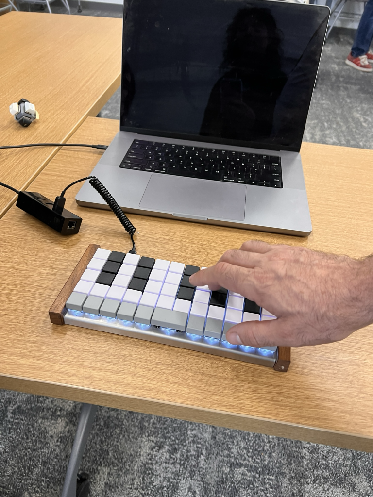 A Preonic dressed up like a synth, and capable of outputting not only MIDI notes but also music through a tiny, tinny piezo speaker.